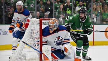 May 23, 2024; Dallas, Texas, USA; Edmonton Oilers goaltender Stuart Skinner (74) and Dallas Stars left wing Jamie Benn (14) look for the puck during the overtime period in game one of the Western Conference Final of the 2024 Stanley Cup Playoffs at American Airlines Center. Mandatory Credit: Jerome Miron-USA TODAY Sports