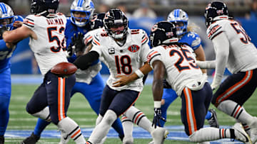 Sep 14, 2025; Detroit, Michigan, USA; Chicago Bears quarterback Caleb Williams (18) looks to hand off the ball to Chicago Bears running back Kyle Monangai (25) during the second quarter of the game at Ford Field. Mandatory Credit: Lon Horwedel-Imagn Images