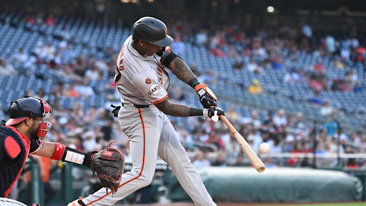 Aug 5, 2024; Washington, District of Columbia, USA; San Francisco Giants shortstop Marco Luciano (37) hits the ball into play against the Washington Nationals during the fourth inning at Nationals Park. 