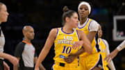 Los Angeles Sparks forward Rickea Jackson holds back guard Kelsey Plum after tempers flared in the second half against the Chicago Sky.