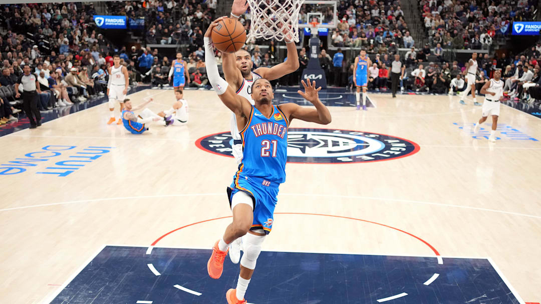 Nov 4, 2025; Inglewood, California, USA; Oklahoma City Thunder guard Aaron Wiggins (21) shoots the ball against LA Clippers forward Nicolas Batum (33) in the second half at Intuit Dome. Mandatory Credit: Kirby Lee-Imagn Images