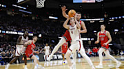 Mar 23, 2025; Cleveland, OH, USA; Alabama Crimson Tide forward Grant Nelson (4) looks to the basket defended by St. Mary's Gaels center Mitchell Saxen (11) in the second half during the NCAA Tournament Second Round at Rocket Arena. Mandatory Credit: Rick Osentoski-Imagn Images