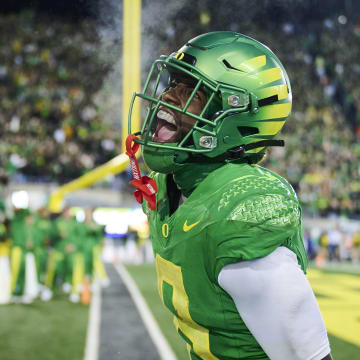 Nov 24, 2023; Eugene, Oregon, USA; Oregon Ducks defensive back Dontae Manning (8) celebrates after intercepting a pass in the end zone during the second half against the Oregon State Beavers at Autzen Stadium.