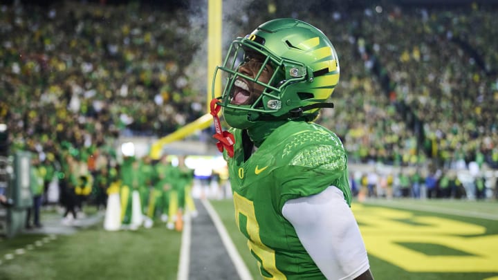Nov 24, 2023; Eugene, Oregon, USA; Oregon Ducks defensive back Dontae Manning (8) celebrates after intercepting a pass in the end zone during the second half against the Oregon State Beavers at Autzen Stadium. Mandatory Credit: Troy Wayrynen-USA TODAY Sports
