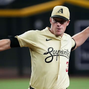 Aug 13, 2024; Phoenix, Arizona, USA; Arizona Diamondbacks pitcher Joe Mantiply (35) pitches against the Colorado Rockies during the ninth inning at Chase Field. Mandatory Credit: Joe Camporeale-Imagn Images