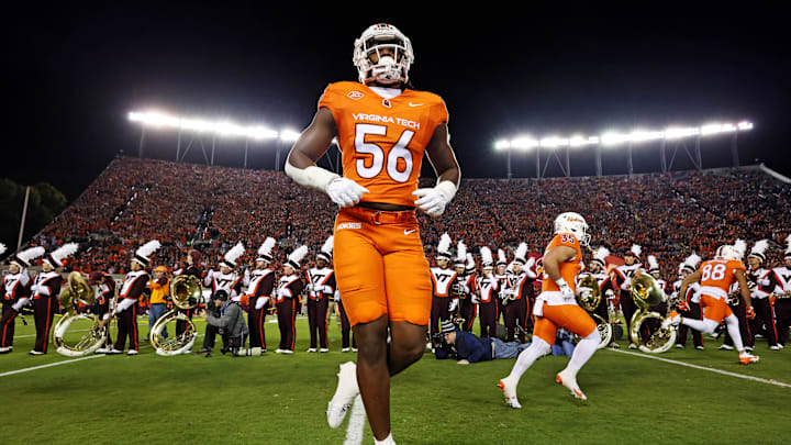 Oct 17, 2024; Blacksburg, Virginia, USA; Virginia Tech Hokies defensive lineman C.J. McCray (56) runs onto the field before paying against the Boston College Eagles at Lane Stadium. Mandatory Credit: Peter Casey-Imagn Images