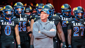 Nov 9, 2024; Kansas City, Missouri, USA; Kansas Jayhawks coach Lance Leipold leads the team onto the field for the game against the Iowa State Cyclones at GEHA Field at Arrowhead Stadium. Mandatory Credit: William Purnell-Imagn Images