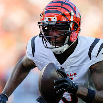 Cincinnati Bengals wide receiver Tee Higgins (5) runs in for a touchdown in the first quarter of the NFL Preseason Week 1 game between the Cincinnati Bengals and the Tampa Bay Buccaneers at Paycor Stadium in downtown Cincinnati on Saturday, Aug. 10, 2024.