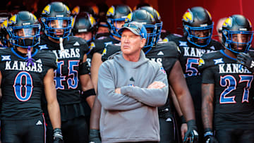 Nov 9, 2024; Kansas City, Missouri, USA; Kansas Jayhawks coach Lance Leipold leads the team onto the field for the game against the Iowa State Cyclones at GEHA Field at Arrowhead Stadium. Mandatory Credit: William Purnell-Imagn Images