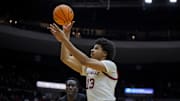 Nov 21, 2025; Cincinnati, Ohio, USA; Louisville Cardinals forward Sananda Fru (13) drives to the basket against the Cincinnati Bearcats in the first half at Heritage Bank Center. Mandatory Credit: Aaron Doster-Imagn Images
