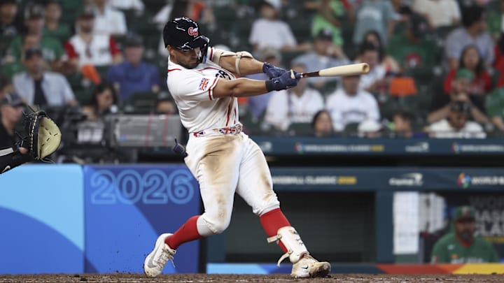 Mar 6, 2026; Houston, TX, United States; Great Britain catcher Harry Ford (1) hits a home run during the sixth inning against Mexico at Daikin Park. Mandatory Credit: Troy Taormina-Imagn Images