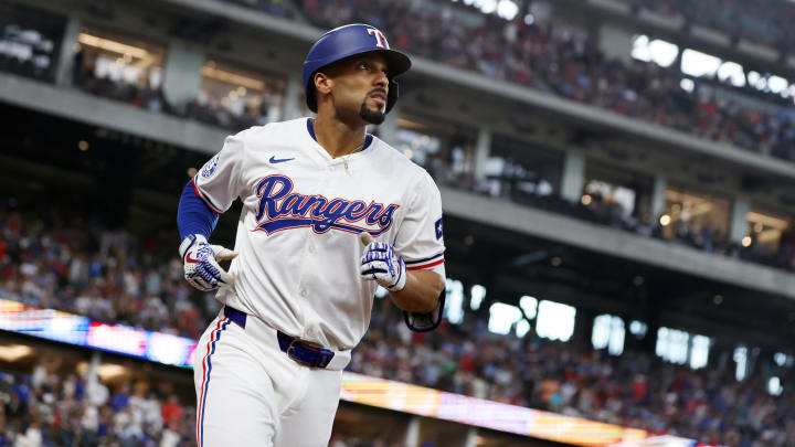 Jul 25, 2024; Arlington, Texas, USA;  Texas Rangers second base Marcus Semien (2) runs back to the dugout after hitting a two run home run against the Chicago White Sox in the third inning at Globe Life Field. Mandatory Credit: Tim Heitman-USA TODAY Sports