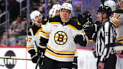 Oct 16, 2024; Denver, Colorado, USA; Boston Bruins defenseman Hampus Lindholm (27) celebrates his goal with teammates in the second period against the Colorado Avalanche at Ball Arena. Mandatory Credit: Ron Chenoy-Imagn Images