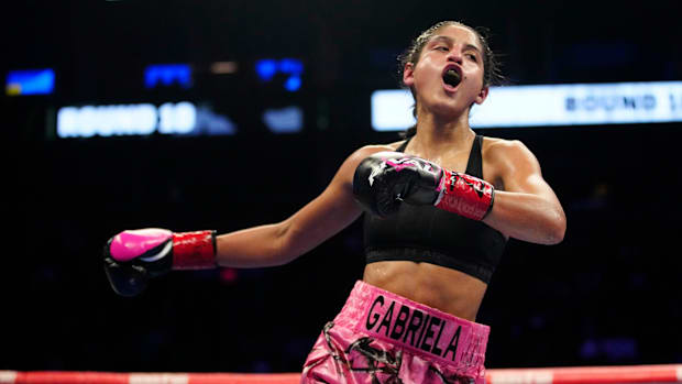 Gabriela Fundora celebrates a TKO against Christina Cruz during The Golden Boy Boxing Series at the Footprint Center.