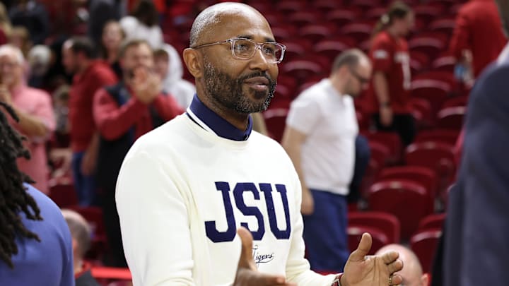 Nov 21, 2025; Fayetteville, Arkansas, USA; Jackson State Tigers head coach Mo Williams congratulates Arkansas Razorbacks players after the game at Bud Walton Arena. Arkansas won 115-61. Mandatory Credit: Nelson Chenault-Imagn Images