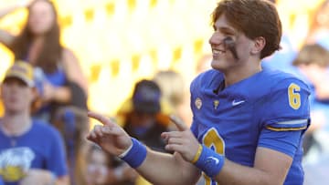 Oct 4, 2025; Pittsburgh, Pennsylvania, USA;  Pittsburgh Panthers quarterback Mason Heintschel (6) leads the Pitt Band in the playing of the alma mater after defeating the Boston College Eagles at Acrisure Stadium. Mandatory Credit: Charles LeClaire-Imagn Images