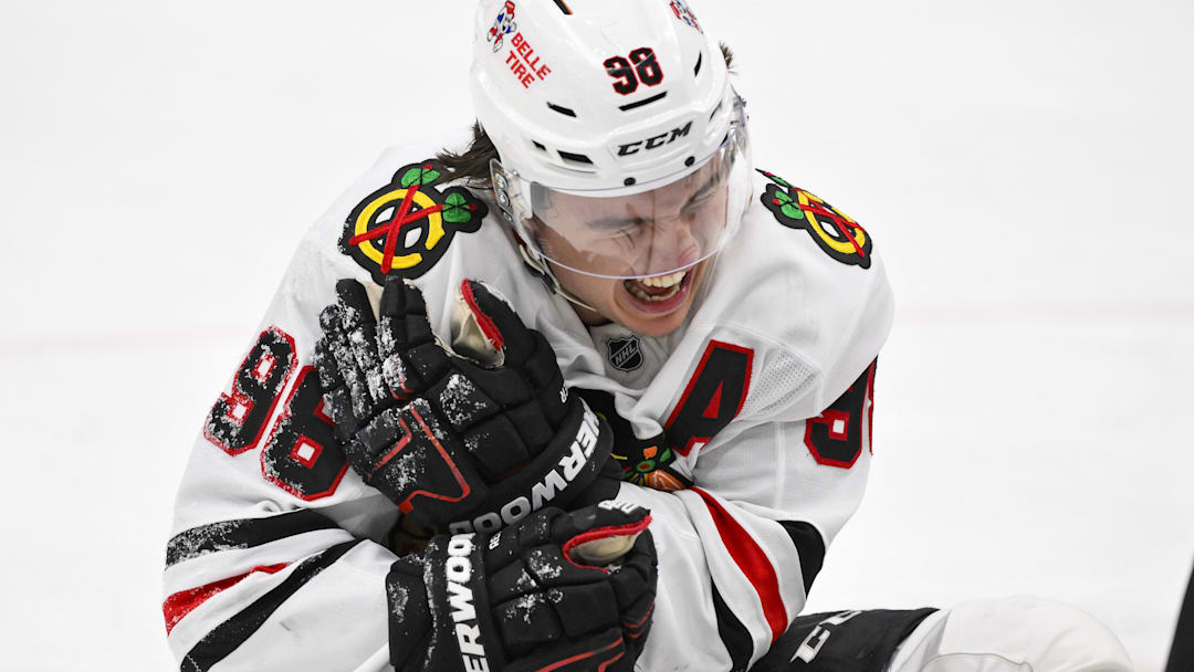 Dec 12, 2025; St. Louis, Missouri, USA; Chicago Blackhawks center Connor Bedard (98) reacts in pain after a face off against St. Louis Blues center Brayden Schenn (not pictured) during the third period at Enterprise Center. Mandatory Credit: Jeff Curry-Imagn Images