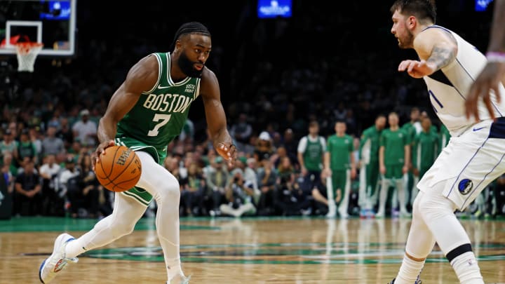 Jun 17, 2024; Boston, Massachusetts, USA; Boston Celtics guard Jaylen Brown (7) drives to the basket against Dallas Mavericks guard Luka Doncic (77) in game five of the 2024 NBA Finals at TD Garden. Mandatory Credit: Peter Casey-USA TODAY Sports