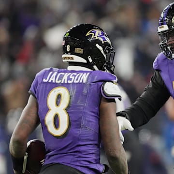 Jan 20, 2024; Baltimore, MD, USA; Baltimore Ravens quarterback Lamar Jackson (8) celebrates with offensive tackle Ronnie Stanley (79) after scoring a touchdown against the Houston Texans during the third quarter of a 2024 AFC divisional round game at M&T Bank Stadium. Mandatory Credit: Mitch Stringer-Imagn Images