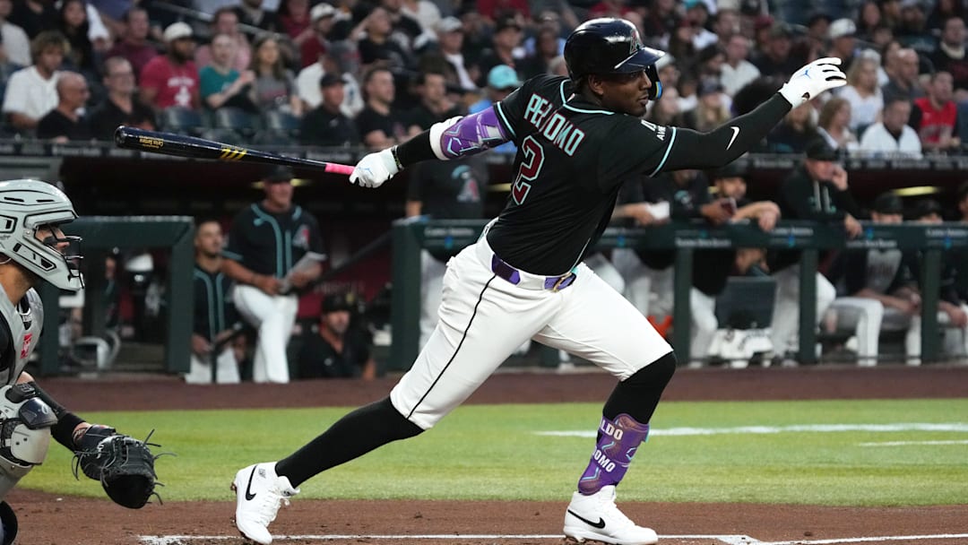 Apr 22, 2026; Phoenix, Arizona, USA; Arizona Diamondbacks shortstop Geraldo Perdomo (2) hits a triple against the Chicago White Sox in the first inning at Chase Field. Mandatory Credit: Rick Scuteri-Imagn Images