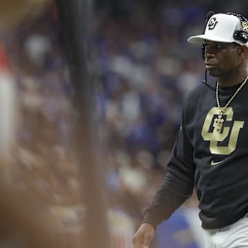 Colorado Buffaloes head coach Deion Sanders walks on the field during the game against the Brigham Young Cougars at Alamodome. 