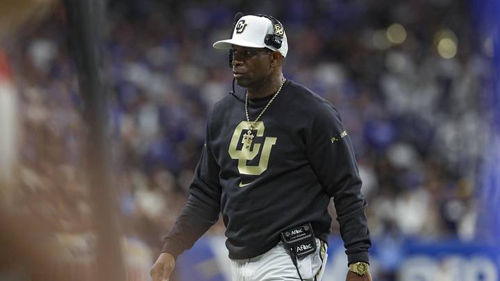 Dec 28, 2024; San Antonio, TX, USA; Colorado Buffaloes head coach Deion Sanders walks on the field during the game against the Brigham Young Cougars at Alamodome. Mandatory Credit: Troy Taormina-Imagn Images