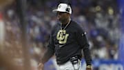 Dec 28, 2024; San Antonio, TX, USA; Colorado Buffaloes head coach Deion Sanders walks on the field during the game against the Brigham Young Cougars at Alamodome. Mandatory Credit: Troy Taormina-Imagn Images