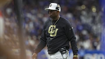 Dec 28, 2024; San Antonio, TX, USA; Colorado Buffaloes head coach Deion Sanders walks on the field during the game against the Brigham Young Cougars at Alamodome. Mandatory Credit: Troy Taormina-Imagn Images