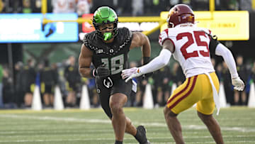 Mackey Award finalist Kenyon Sadiq leads the Ducks into Husky Stadium Saturday afternoon.