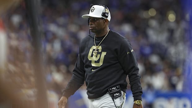 Dec 28, 2024; San Antonio, TX, USA; Colorado Buffaloes head coach Deion Sanders walks on the field during the game against th