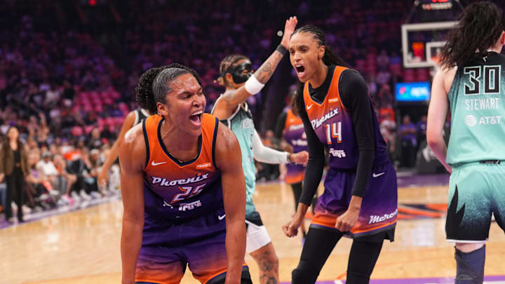 Sep 19, 2025; Phoenix, Arizona, USA; Phoenix Mercury forward Alyssa Thomas (25) and Phoenix Mercury forward DeWanna Bonner (14) react after a foul call against the New York Liberty during the first half of game three of round one for the 2025 WNBA Playoffs at PHX Arena. Mandatory Credit: Joe Camporeale-Imagn Images