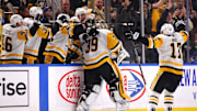 Jan 17, 2025; Buffalo, New York, USA;  Pittsburgh Penguins goaltender Alex Nedeljkovic (39) celebrates his goal with teammates during the third period against the Buffalo Sabres at KeyBank Center. Mandatory Credit: Timothy T. Ludwig-Imagn Images