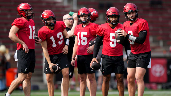 Cincinnati Bearcats quarterback Brendan Sorsby prepares to throw as the other quarterbacks wait their turns during spring football practice, Monday, March 4, 2024, at Nippert Stadium in Cincinnati.