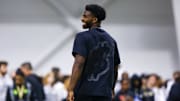 Quarterback Shedeur Sanders (2) laughs during the University of Colorado NFL Showcase at the CU Indoor Practice Facility.  