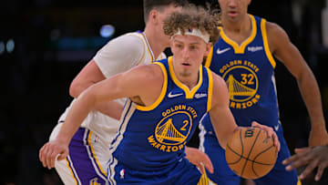 Oct 12, 2025; Los Angeles, California, USA; Golden State Warriors guard Brandin Podziemski (2) handles the ball during the second half at Crypto.com Arena.