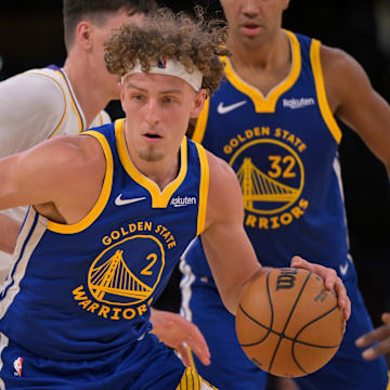 Oct 12, 2025; Los Angeles, California, USA; Golden State Warriors guard Brandin Podziemski (2) handles the ball during the second half at Crypto.com Arena.