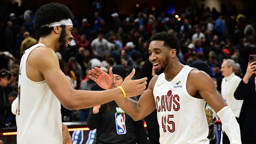 Jan 8, 2025; Cleveland, Ohio, USA; Cleveland Cavaliers guard Donovan Mitchell (45) celebrates with center Jarrett Allen (31) after the Cavaliers beat the Oklahoma City Thunder at Rocket Mortgage FieldHouse. Mandatory Credit: Ken Blaze-Imagn Images