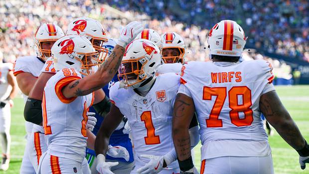 Tampa Bay Buccaneers running back Rachaad White (1) reacts with teammates after scoring a touchdown against the Seahawks
