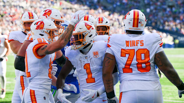 Tampa Bay Buccaneers running back Rachaad White (1) reacts with teammates after scoring a touchdown against the Seattle 