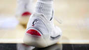 Jan 11, 2025; Cincinnati, Ohio, USA;  The Cincinnati logo is seen on a pair of Air Jordan shoes worn by a member of the Cincinnati Bearcats before the game against the Kansas Jayhawks at Fifth Third Arena. Mandatory Credit: Aaron Doster-Imagn Images