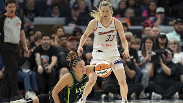 A photo of Kayla McBride diving for a ball