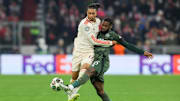 Celtic defender Jeffrey Schlupp extends to kick the ball away from Bayern Munich winger Michael Olise during the UCL. 