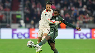 Celtic defender Jeffrey Schlupp extends to kick the ball away from Bayern Munich winger Michael Olise during the UCL. 