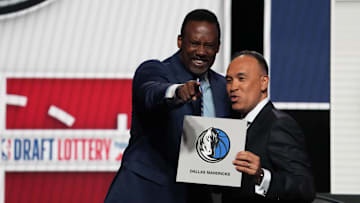 Dallas Mavericks' Rolando Blackman with NBA Deputy Commissioner Mark Tatum winning first pick at the 2025 NBA Draft Lottery