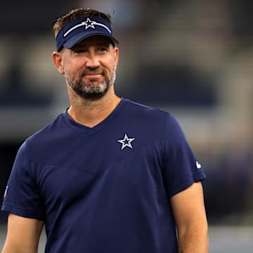 Dallas Cowboys offensive coordinator Brian Schottenheimer on the field before the game against the Las Vegas Raiders.