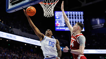 Feb 1, 2025; Lexington, Kentucky, USA; Kentucky Wildcats guard Otega Oweh (00) goes to the rim against Arkansas Razorbacks forward Zvonimir Ivisic (44) during the second half at Rupp Arena at Central Bank Center. Mandatory Credit: Jordan Prather-Imagn Images