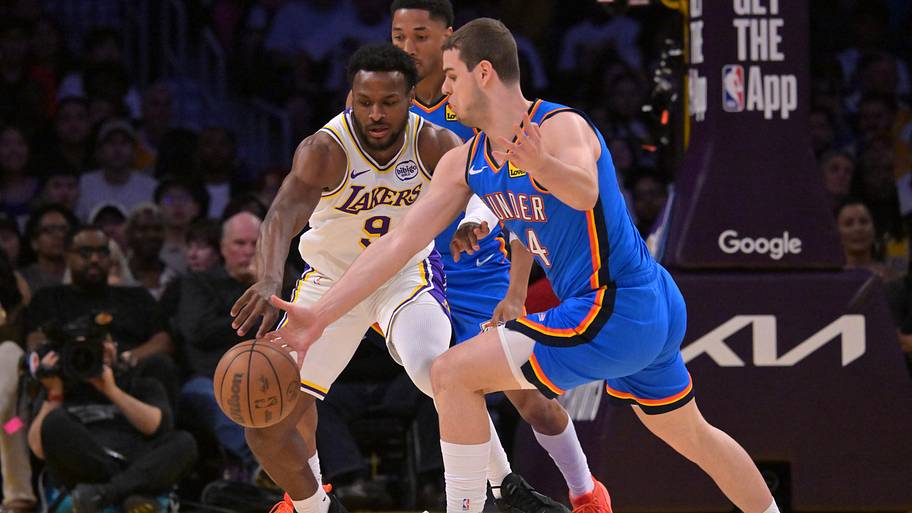 Oklahoma City Thunder guard Nikola Topić steals the ball from Los Angeles Lakers guard Bronny James.