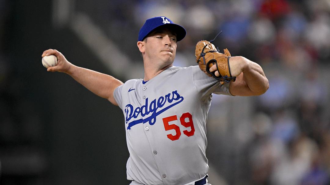 Apr 20, 2025; Arlington, Texas, USA; Los Angeles Dodgers relief pitcher Evan Phillips (59) pitches during the game between the Texas Rangers and the Los Angeles Dodgers at Globe Life Field. Mandatory Credit: Jerome Miron-Imagn Images
