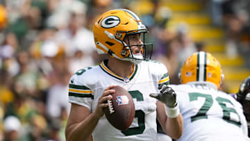 Aug 24, 2024; Green Bay, Wisconsin, USA;  Green Bay Packers quarterback Sean Clifford (6) looks to throw a pass during the second quarter against the Baltimore Ravens at Lambeau Field. Mandatory Credit: Jeff Hanisch-Imagn Images