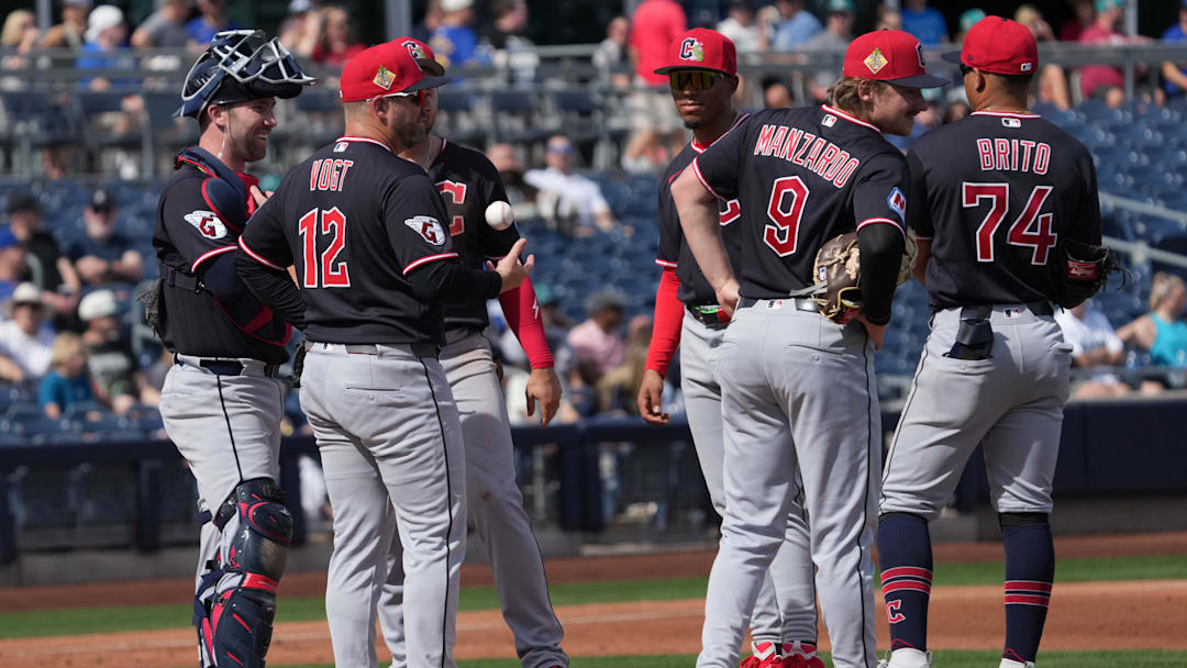 Feb 26, 2026; Peoria, Arizona, USA; Cleveland Guardians manager Stephen Vogt (12) visits the mound against the Seattle Mariners in the first inning at Peoria Sports Complex. Mandatory Credit: Rick Scuteri-Imagn Images